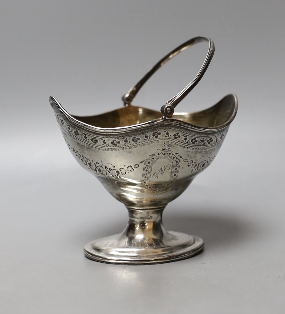 A George III silver oval sugar basket, maker C.S, London, 1787, width 12.1cm, 156 grams.